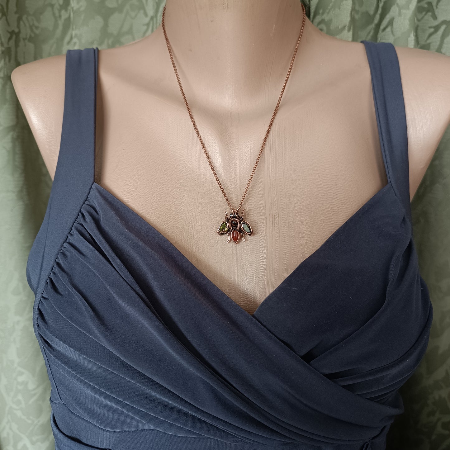 Green olive wings bee charm.