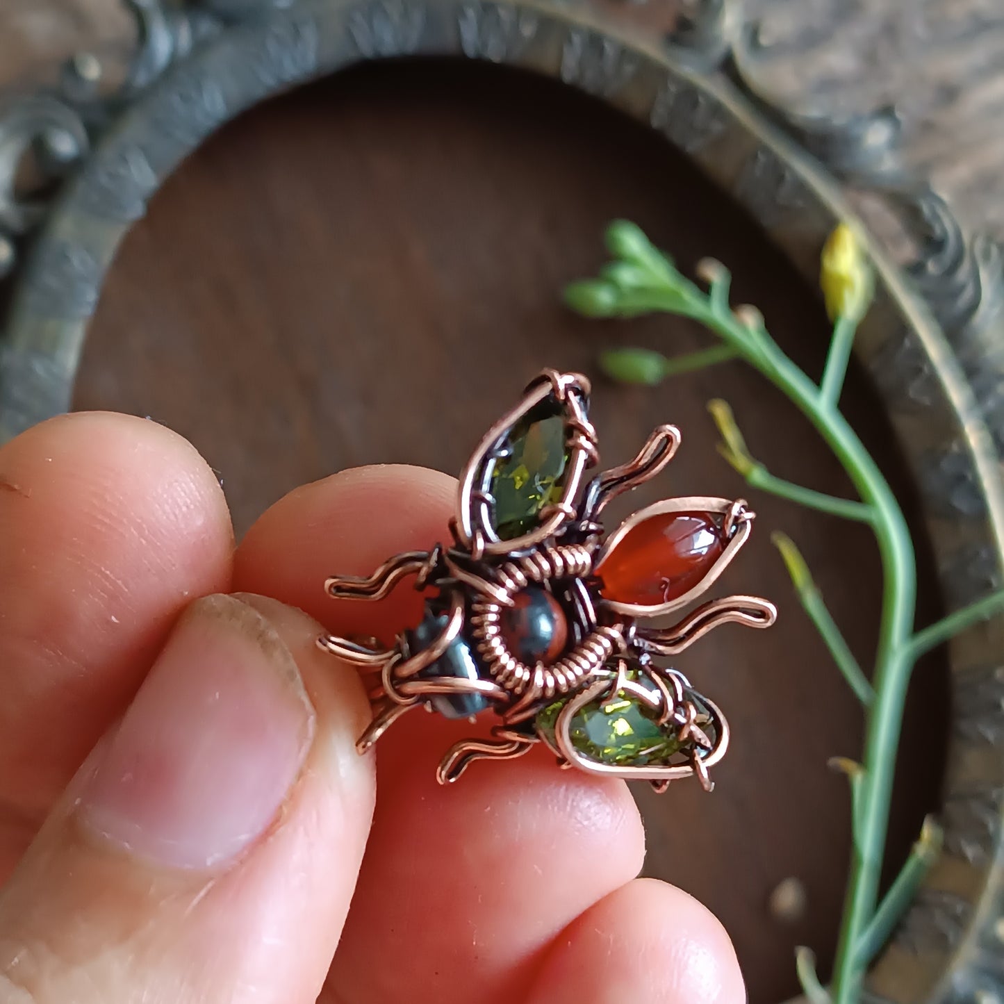 Green olive wings bee charm.