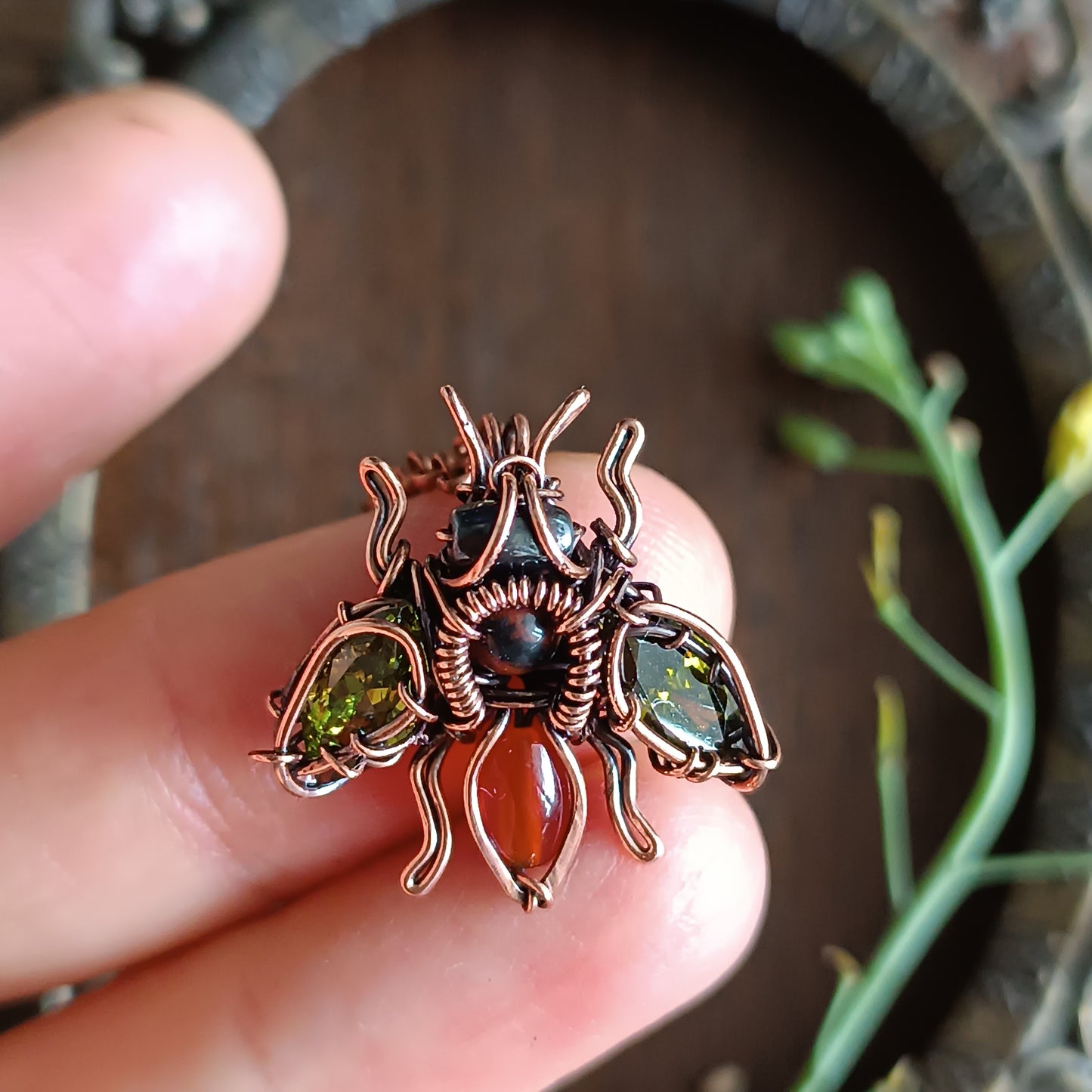 Green olive wings bee charm.