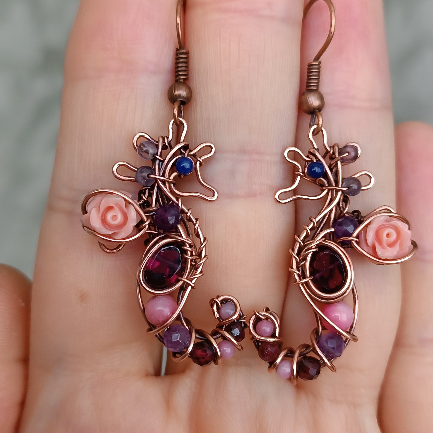 Seahorse dangling earrings.