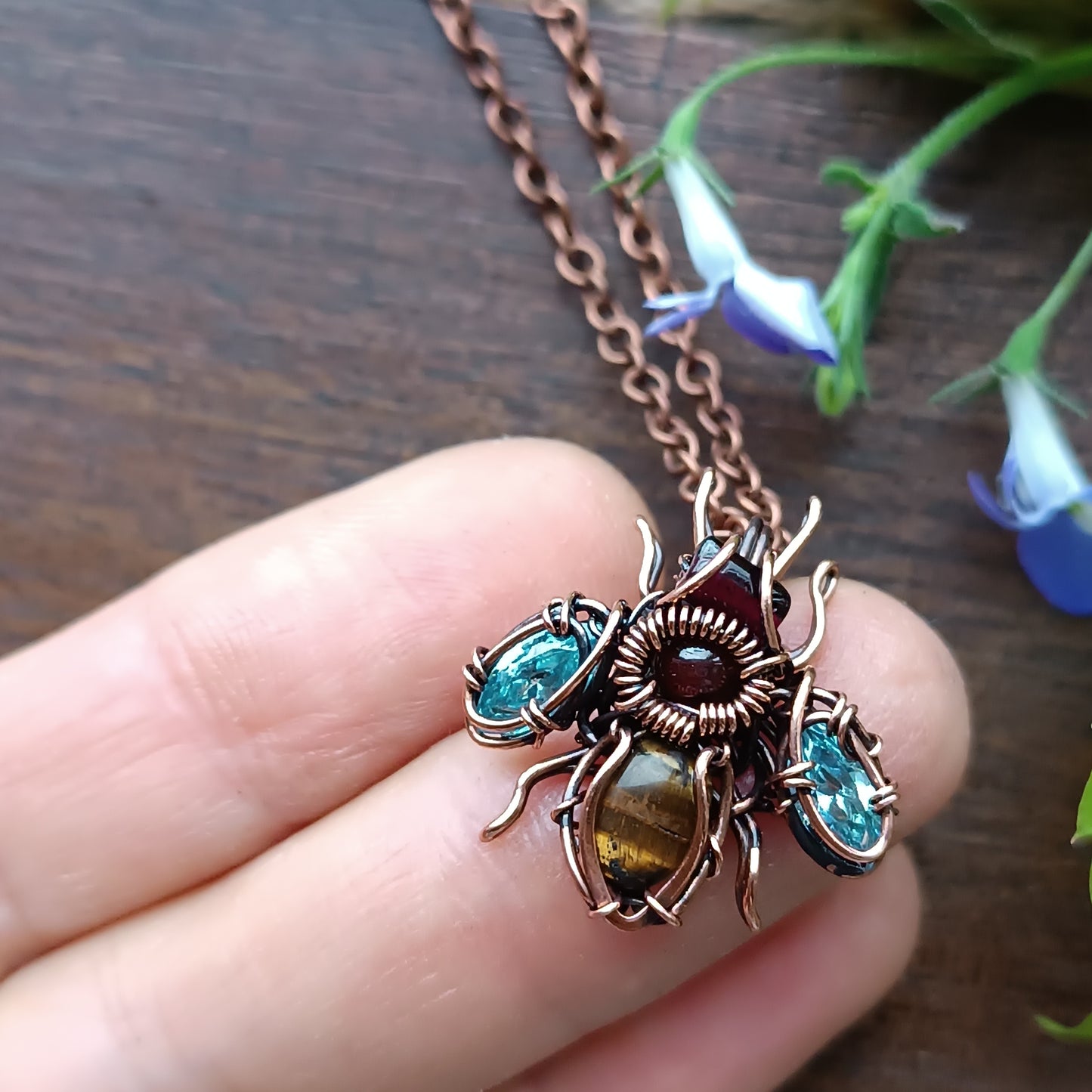 Tiny blue sparkle wings bee charm.