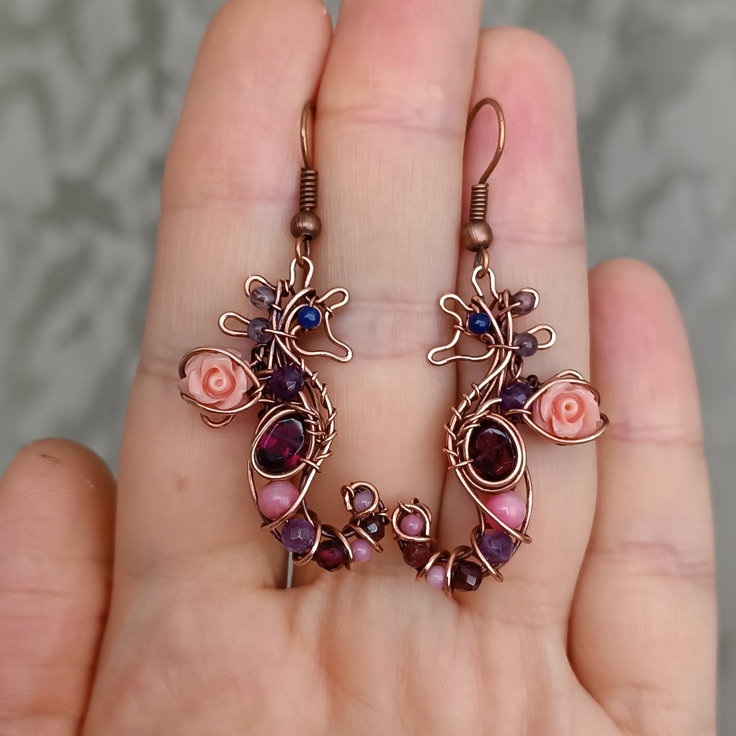 Seahorse dangling earrings.
