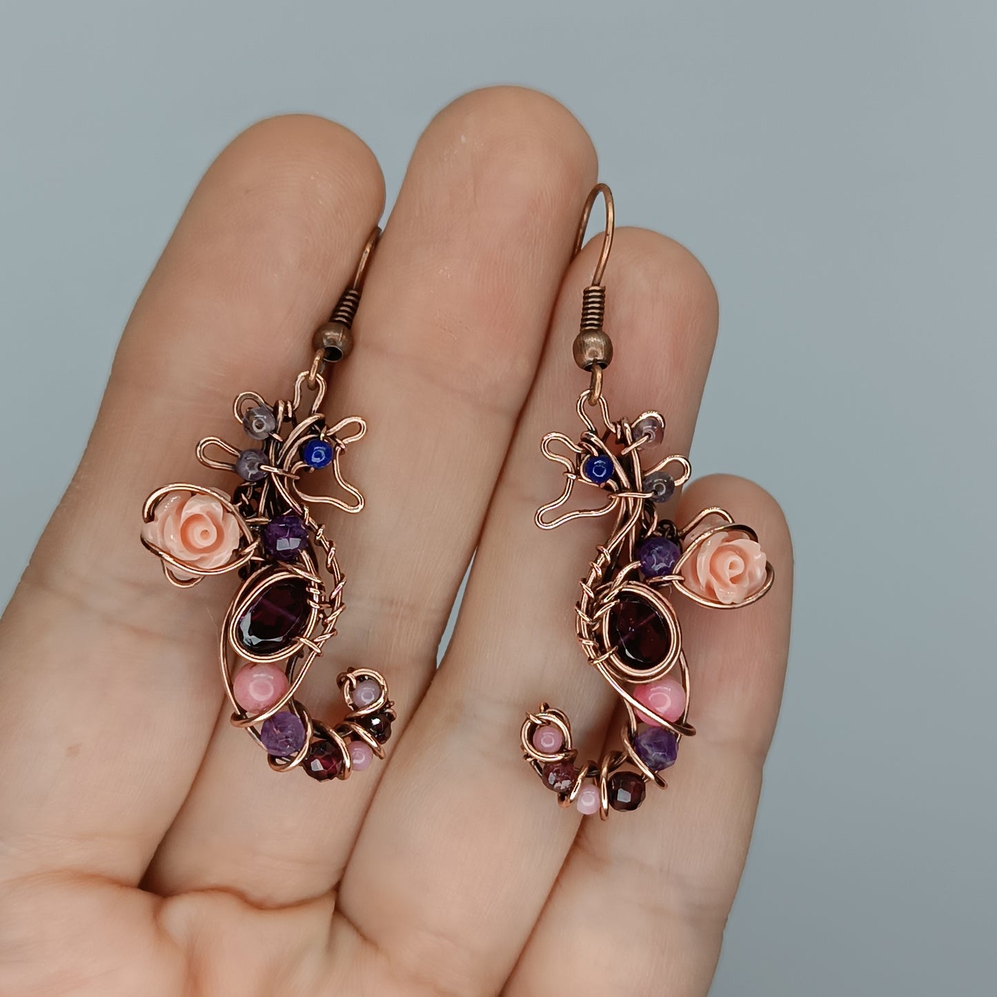 Seahorse dangling earrings.