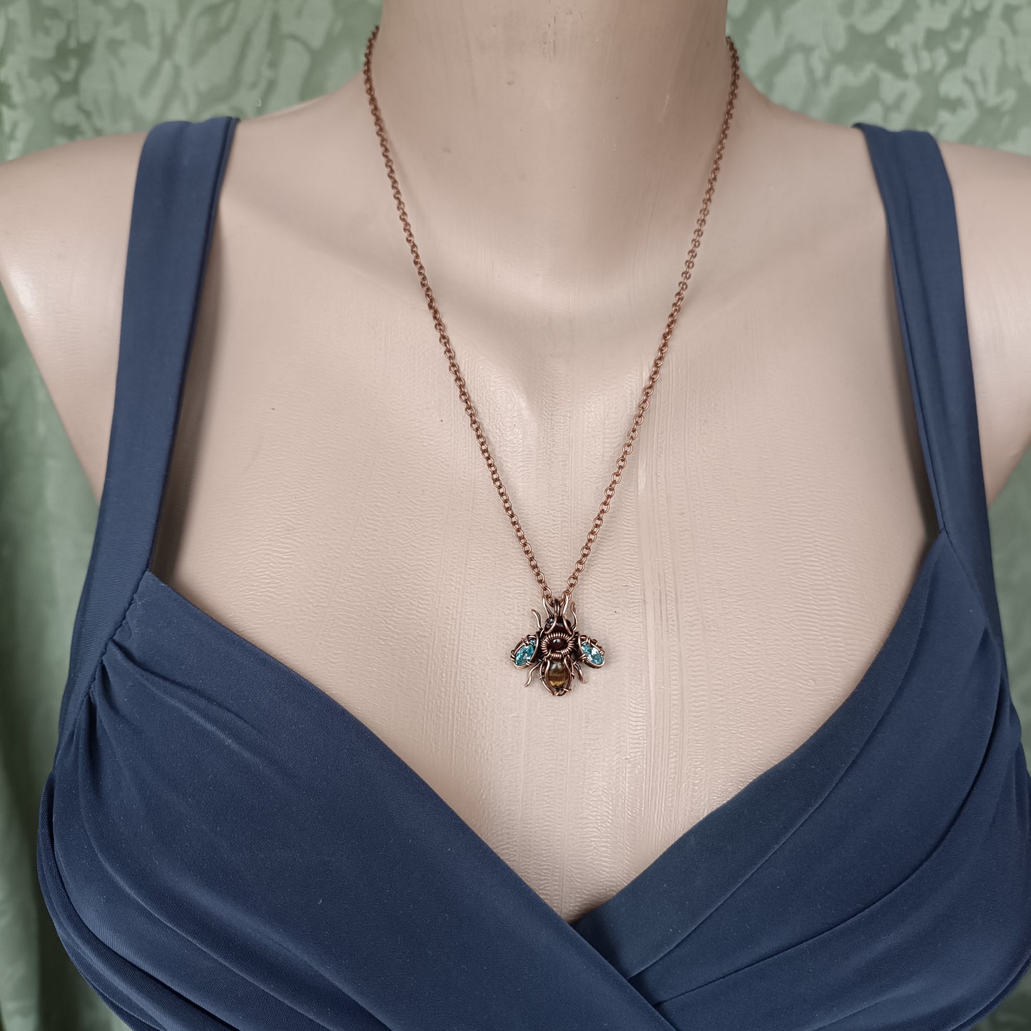 Tiny blue sparkle wings bee charm.
