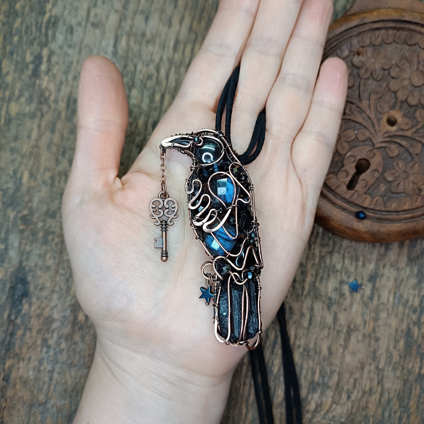 Secret keeper. Raven with the blue star. Wire wrapped necklace