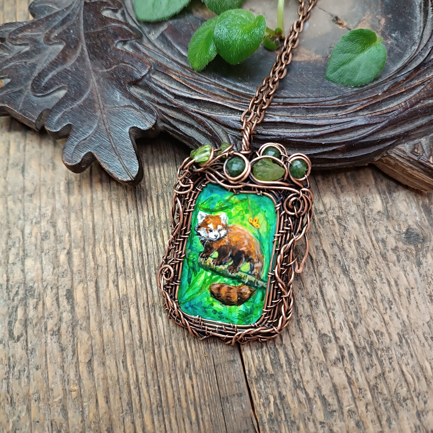 Red panda and a butterfly necklace. Reversible.