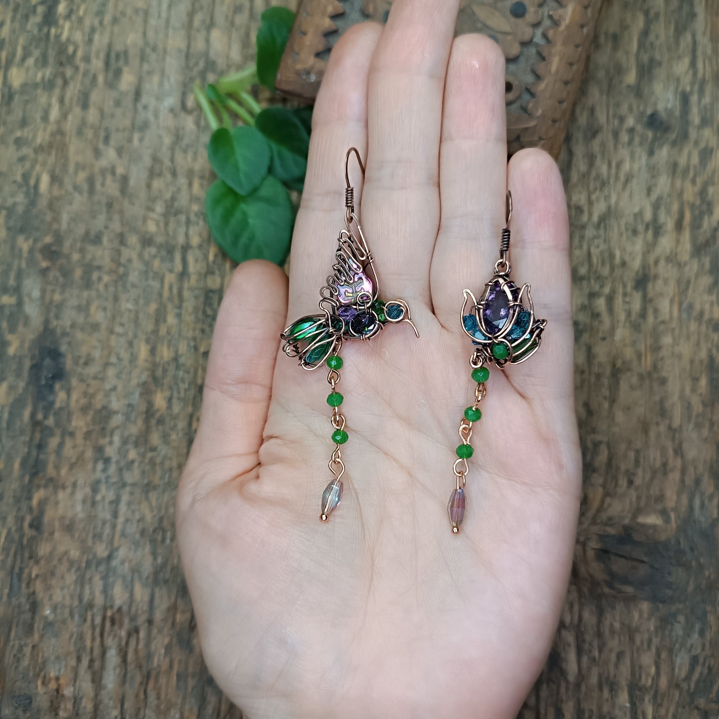 Humming bird and flower dangling earrings.