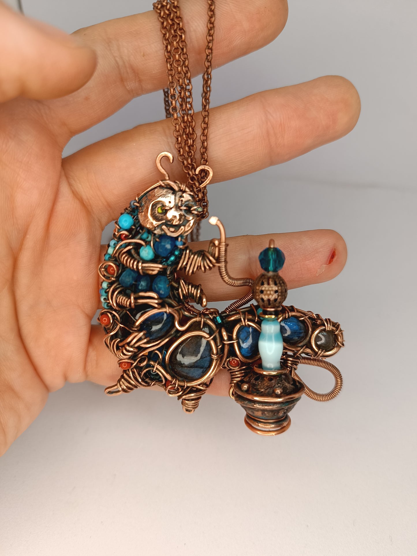 Blue caterpillar necklace
