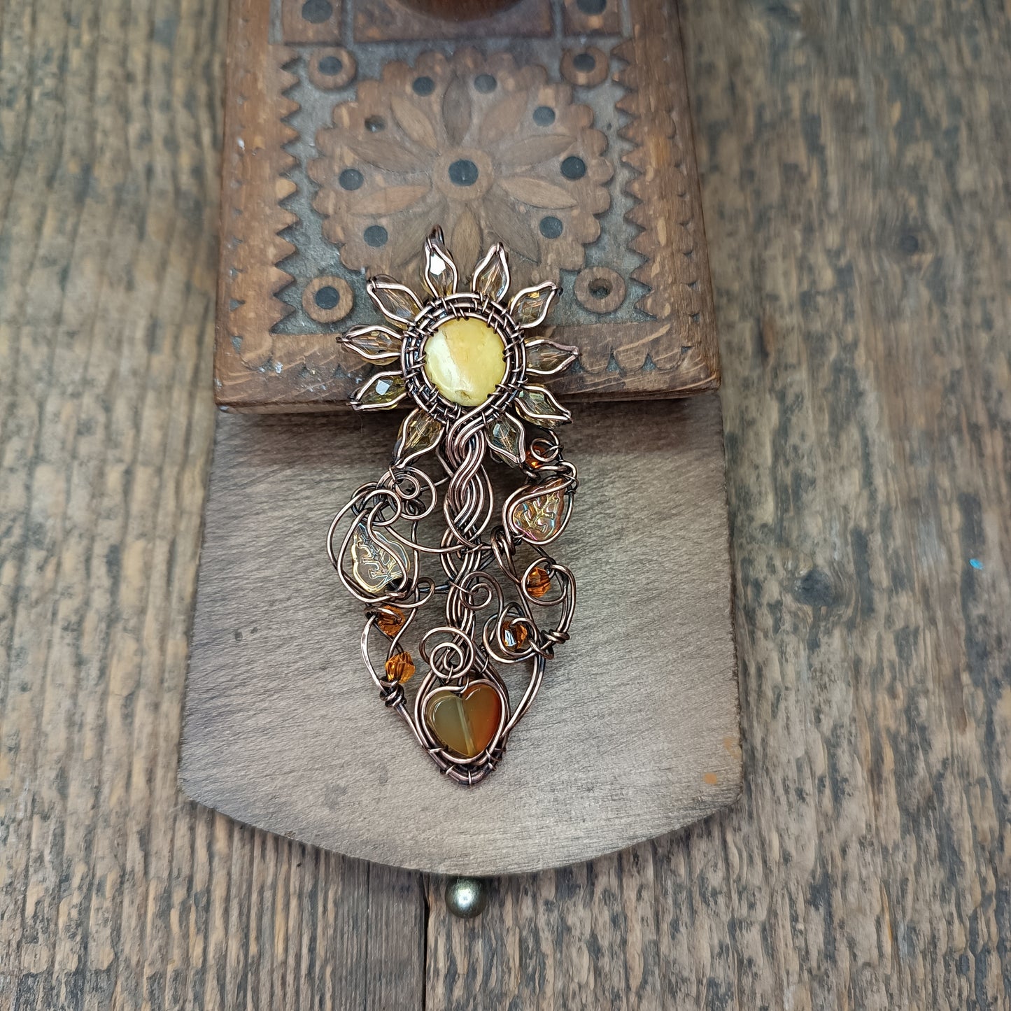 Sunflower pendant with carnelian heart root