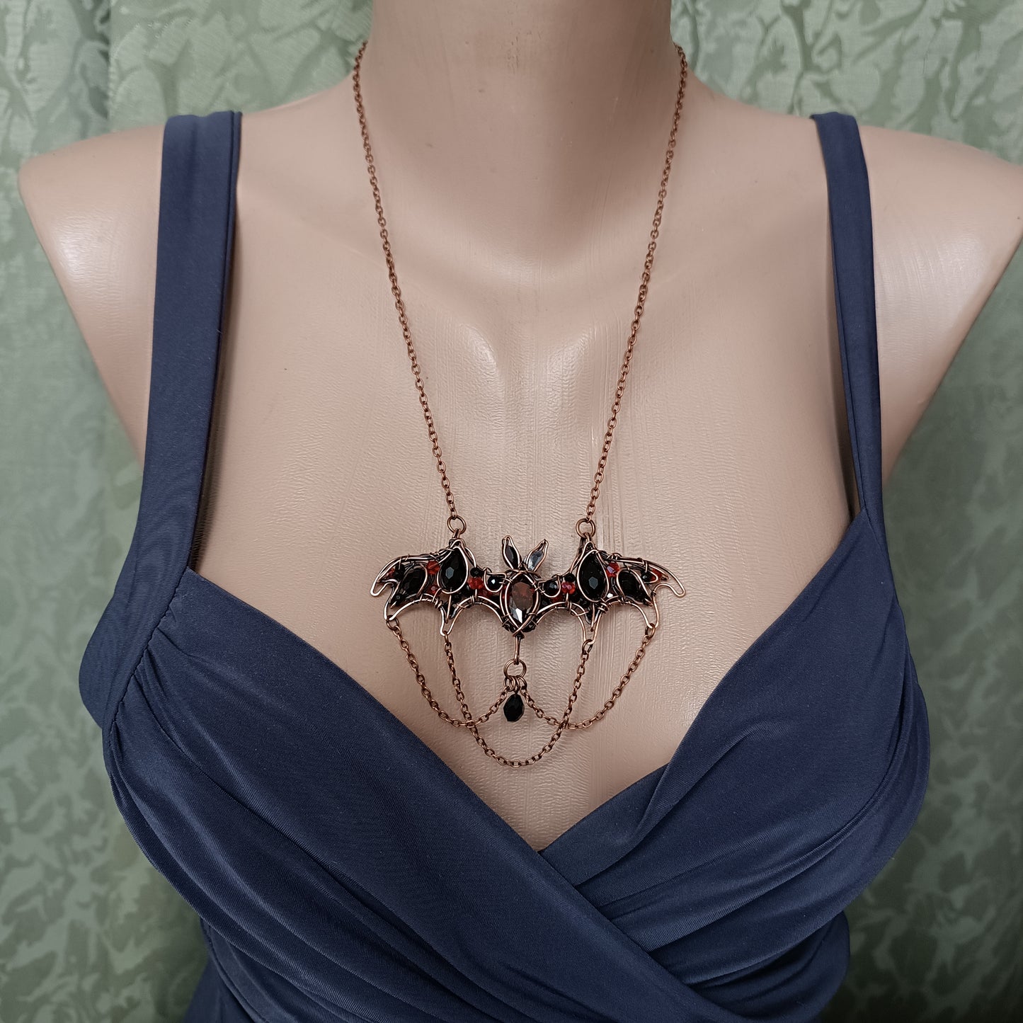 Scarlet dance. Bat necklace.