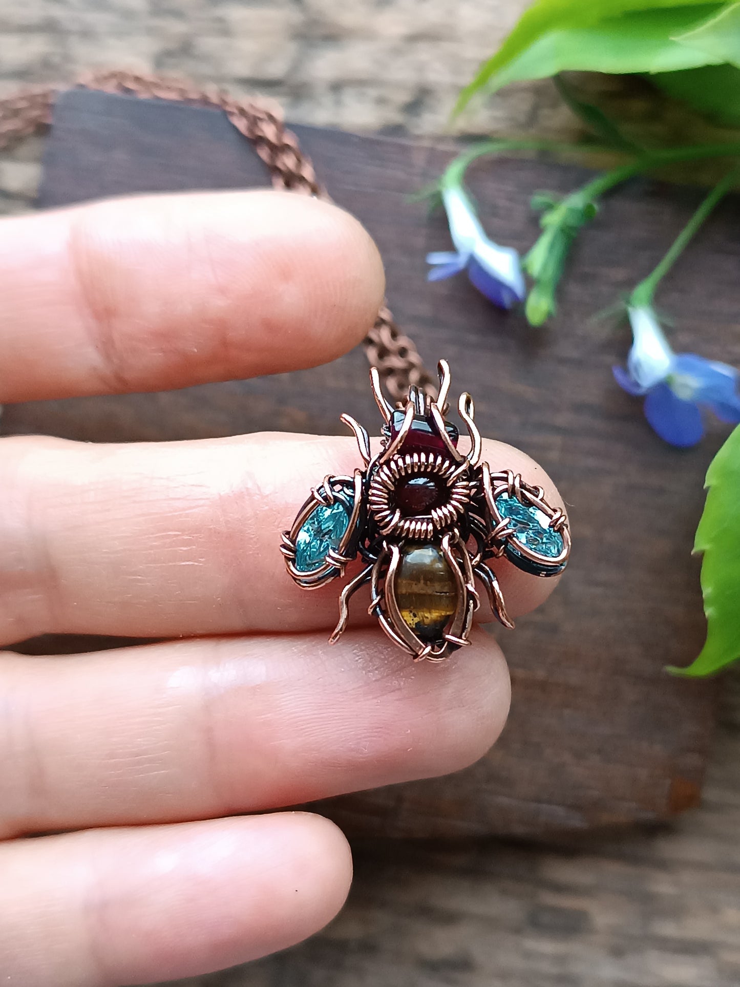 Tiny blue sparkle wings bee charm.