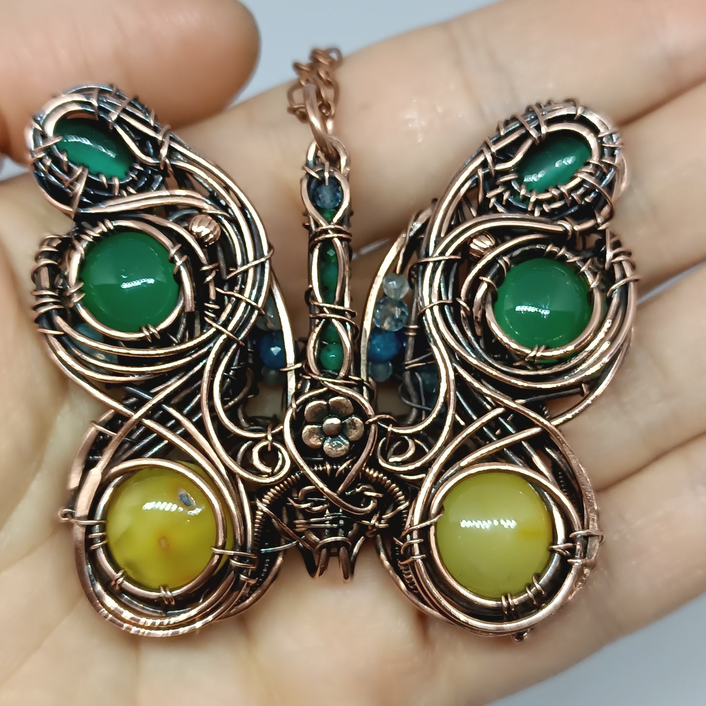 Reversible butterfly necklace.