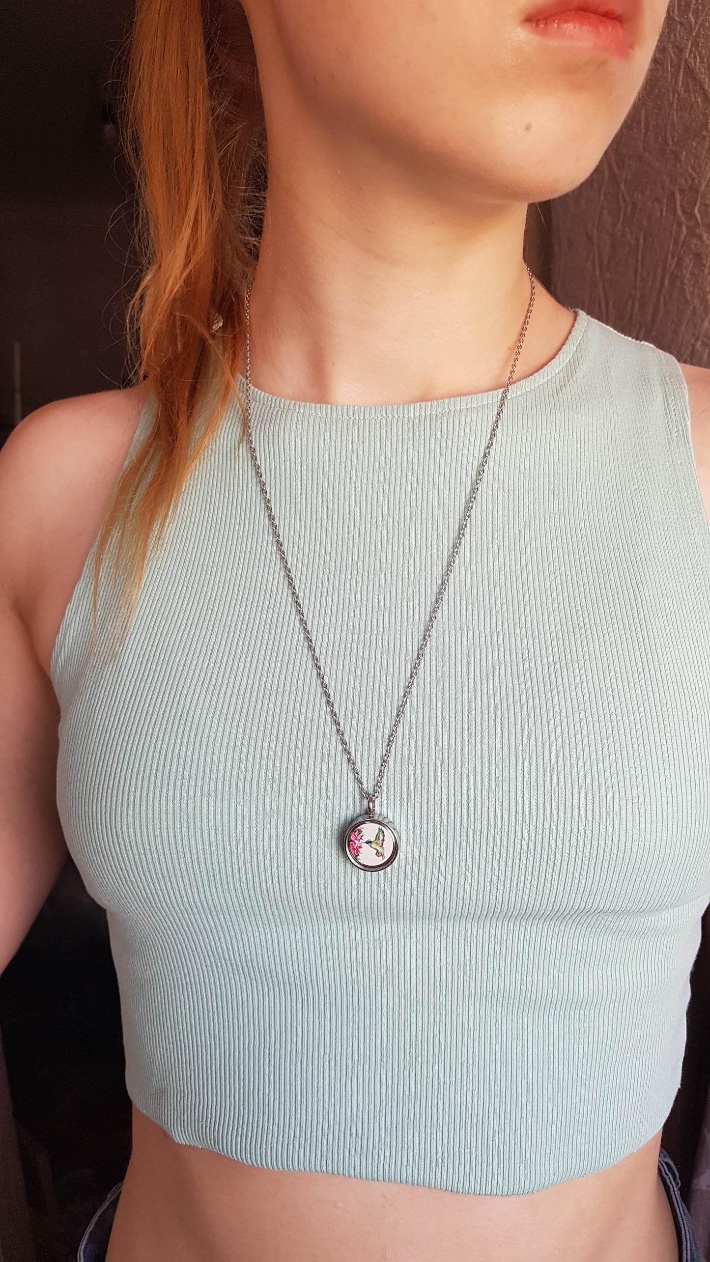 Hummingbird and pink flowers. Double sided mini locket.