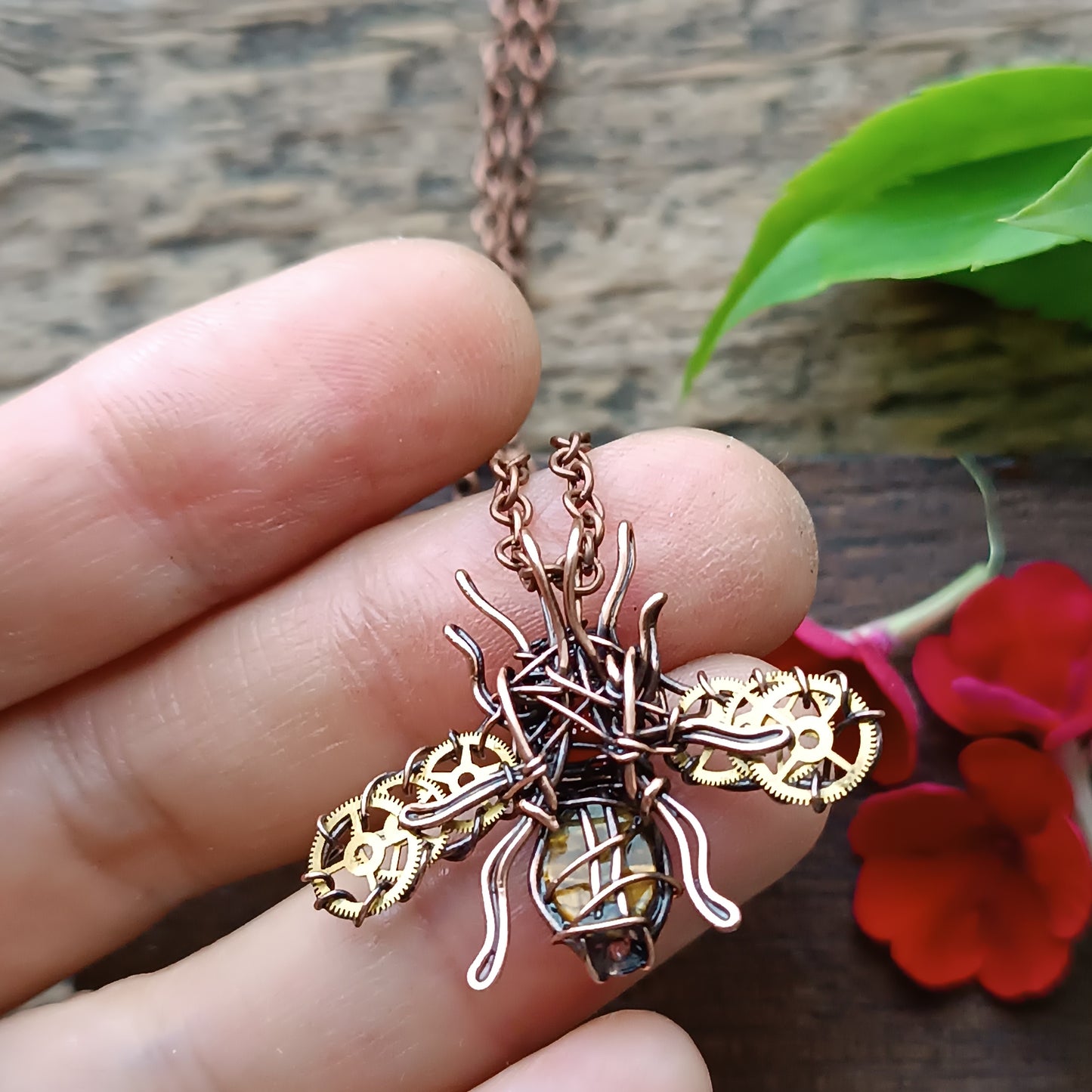 Small golden cogs wings bee charm.