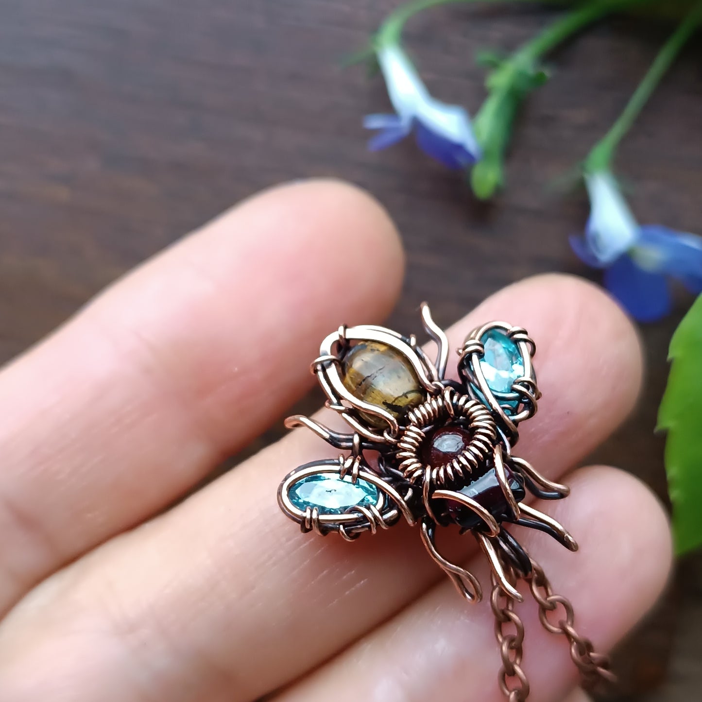 Tiny blue sparkle wings bee charm.