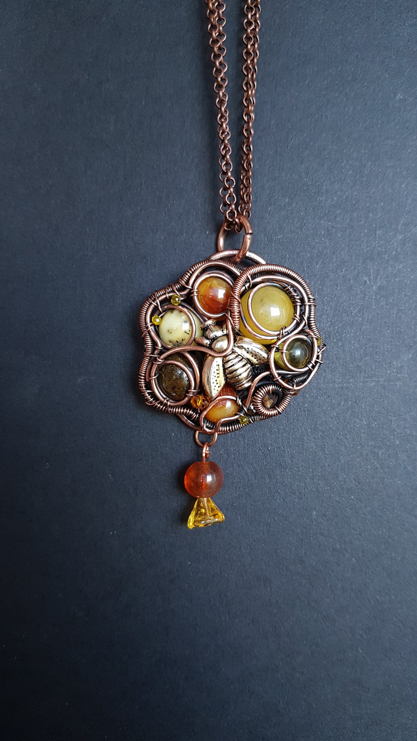 Bee pollinating. Wire wrapped pendant.