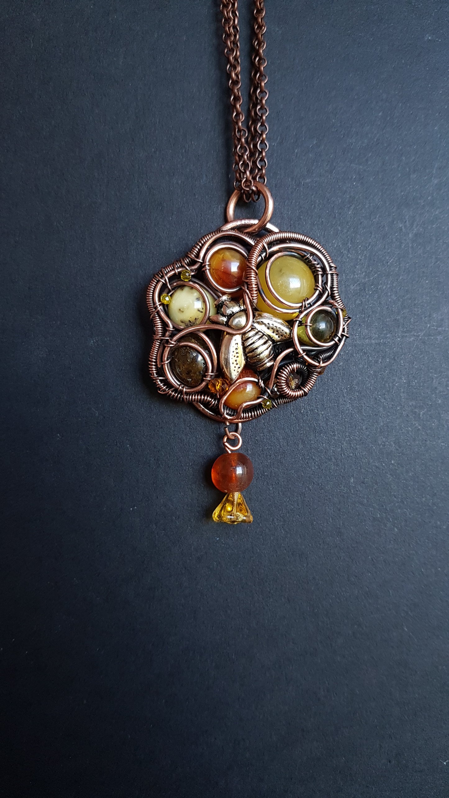 Bee pollinating. Wire wrapped pendant.