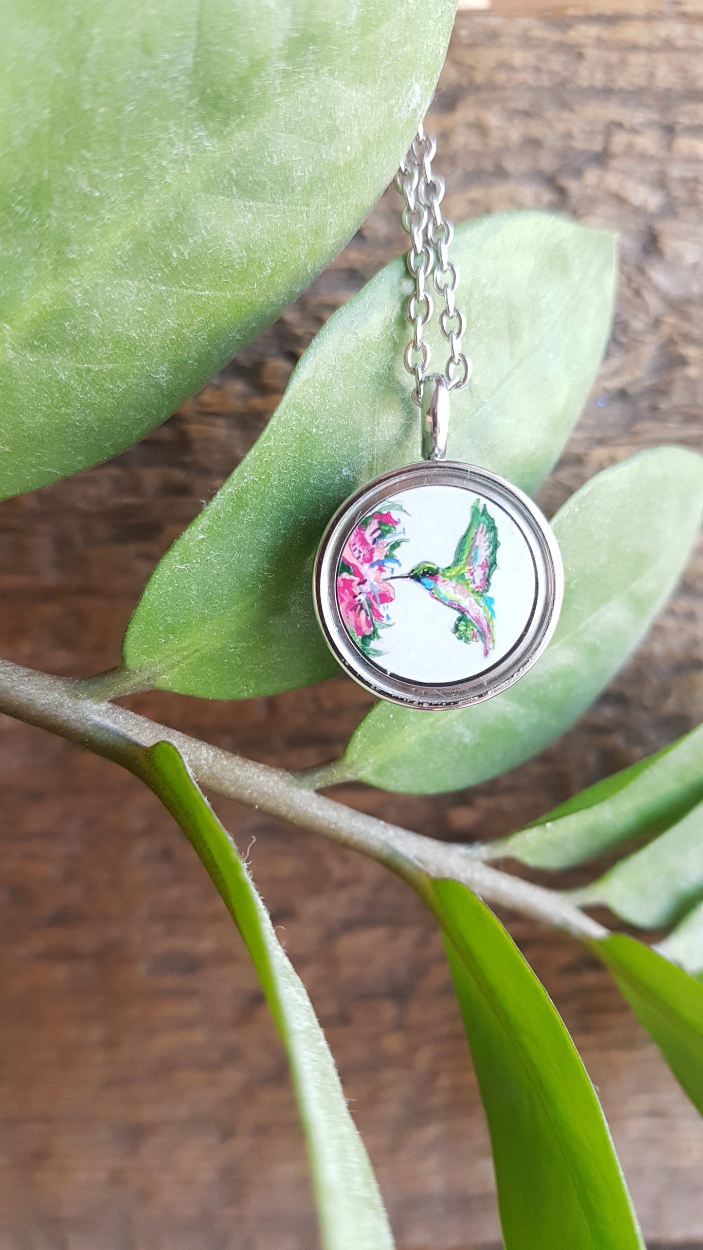 Hummingbird and pink flowers. Double sided mini locket.