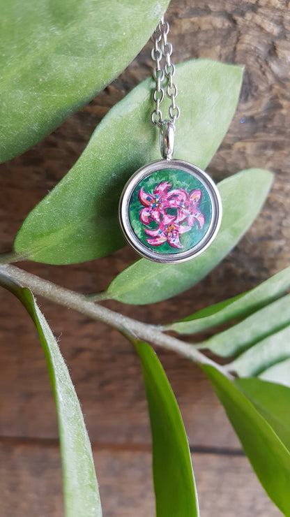 Hummingbird and pink flowers. Double sided mini locket.