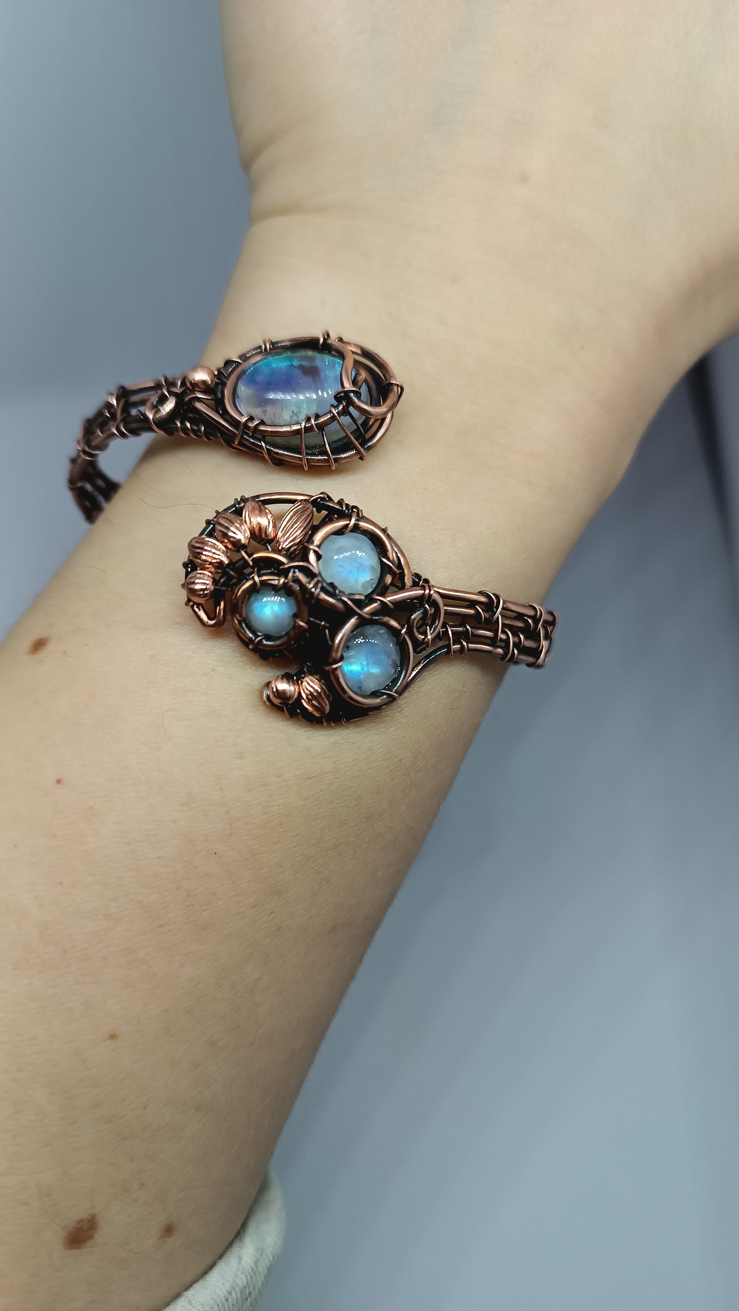 S-M size wrist Adjustable copper bracelet with moonstones and rainbow quartz.