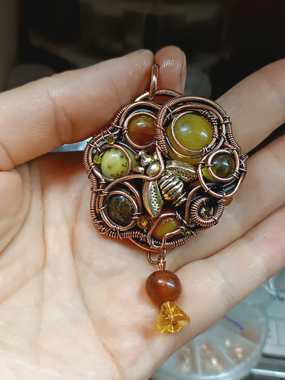 Bee pollinating. Wire wrapped pendant.