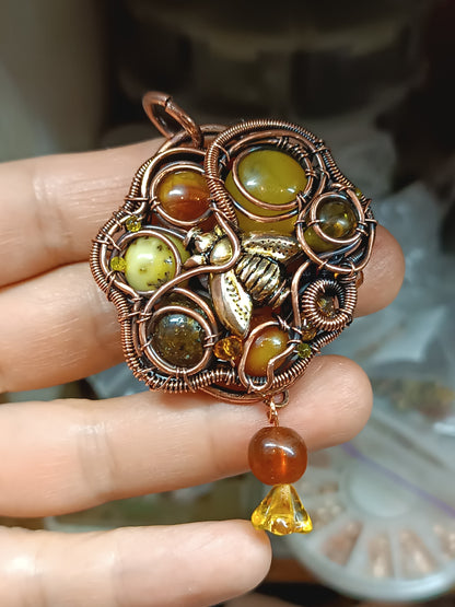 Bee pollinating. Wire wrapped pendant.