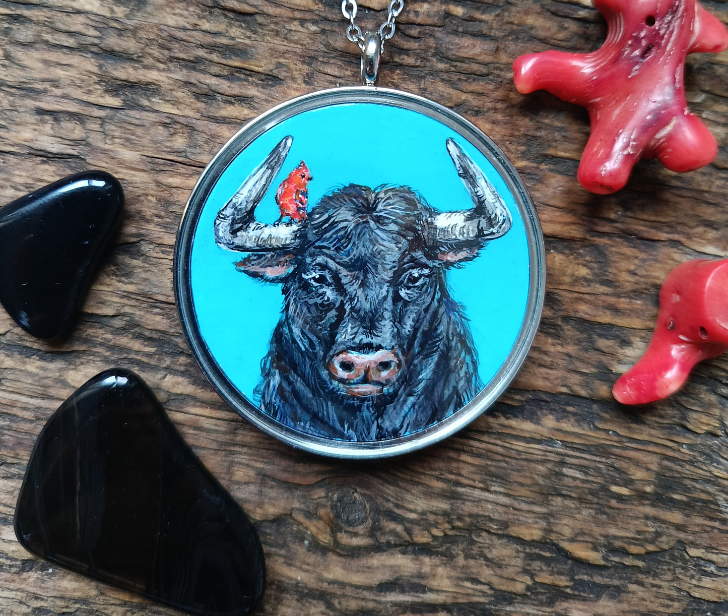 Riding a bull pendant