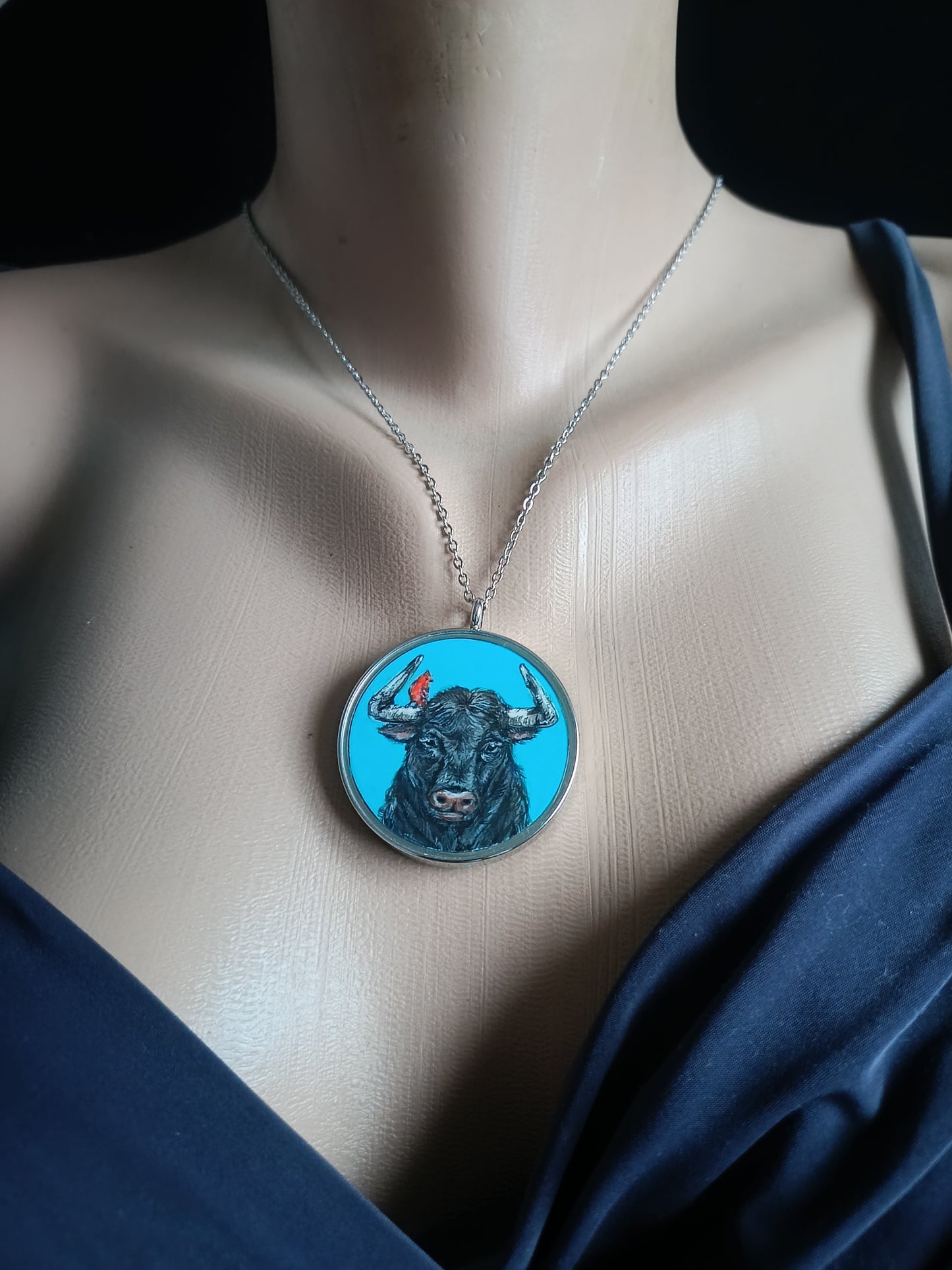 Riding a bull pendant