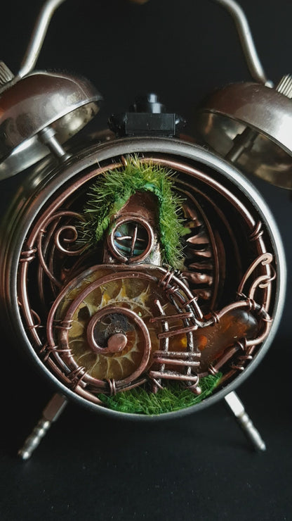 Snail fairy house. Mini world in a clock. Steampunk decor with light.