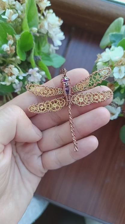 Dragonfly pendant with cogs.