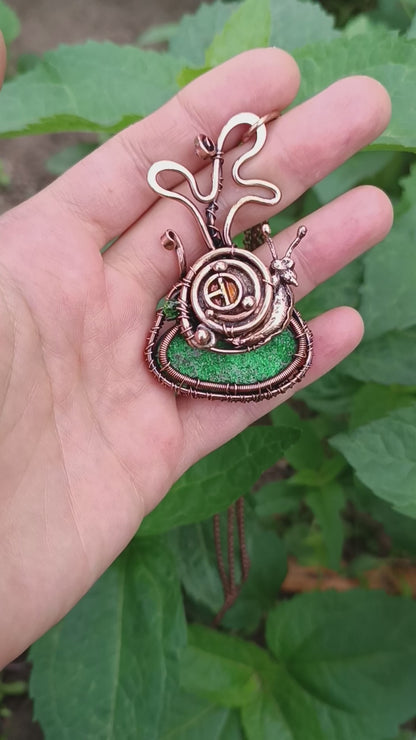 Snail house fairy house necklace with uvarovite.