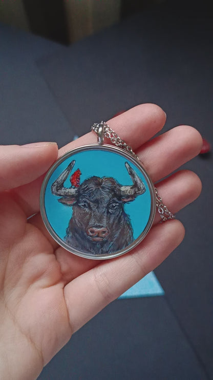 Riding a bull pendant