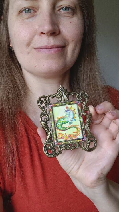 Magic unicorn. Miniature watercolour painting in a frame.