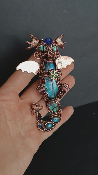 Blue baby dragon with shamrock necklace.