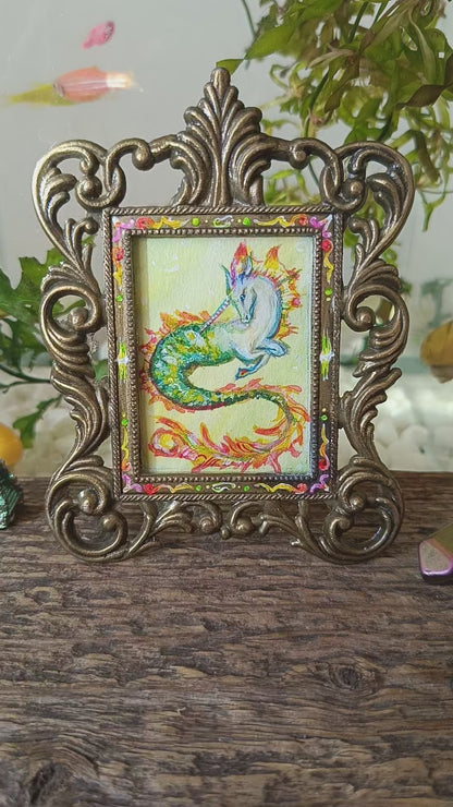 Magic unicorn. Miniature watercolour painting in a frame.
