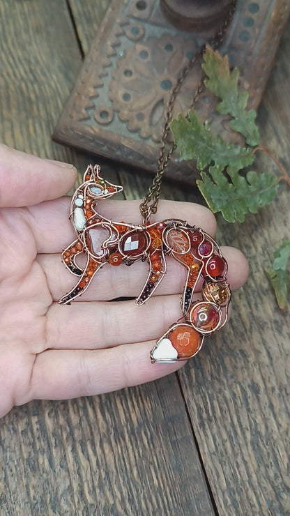 Foxy the swoopy tail! Copper necklace with carnelians.