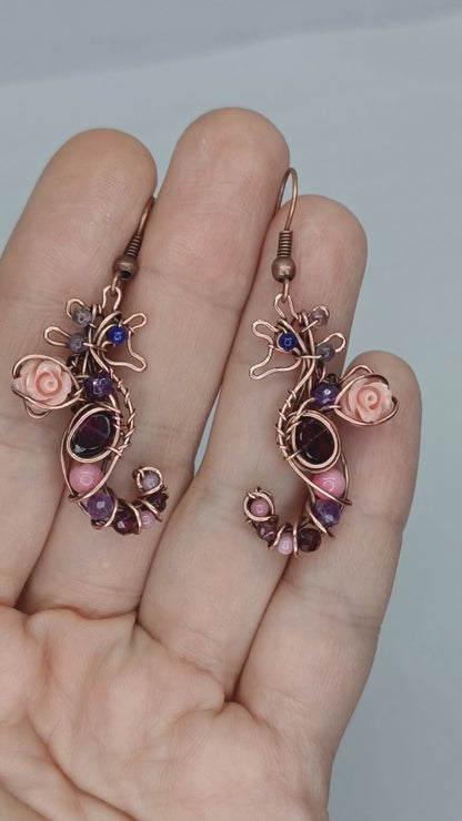 Seahorse dangling earrings.