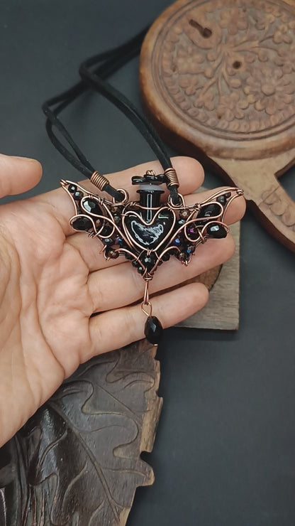 Black (with some purple) bat bottle necklace