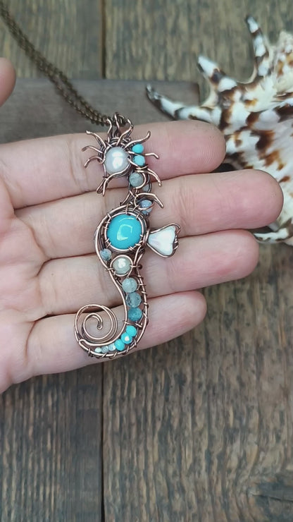 Blue and white seahorse pendant