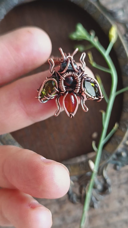Green olive wings bee charm.