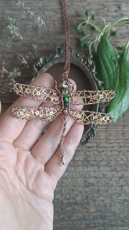Large green dragonfly with golden cogs.