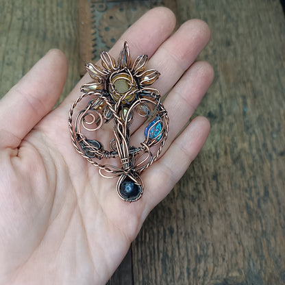 Sunflower pendant with black pearl root