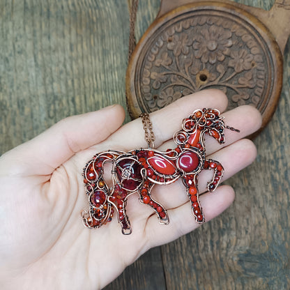Red horse pendant.