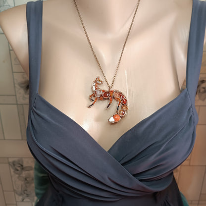 Foxy the swoopy tail! Copper necklace with carnelians.