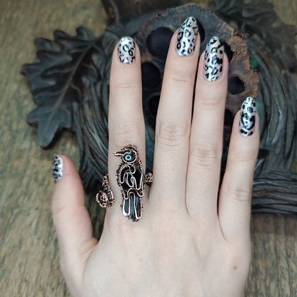 Raven ring.