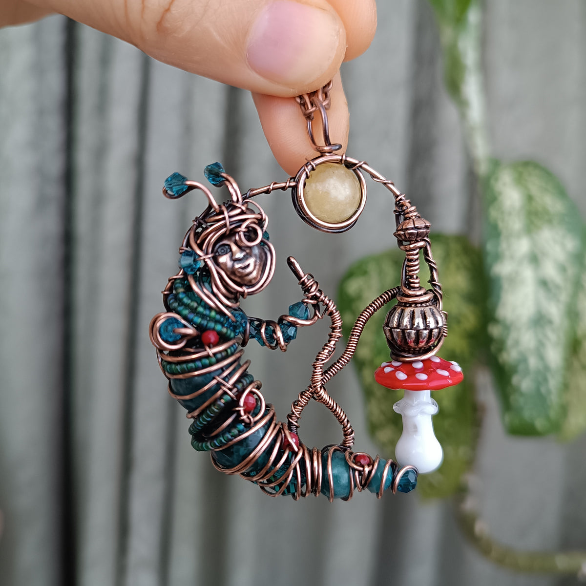 Blue caterpillar necklace
