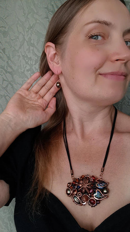 Beaded statement necklace and earrings.