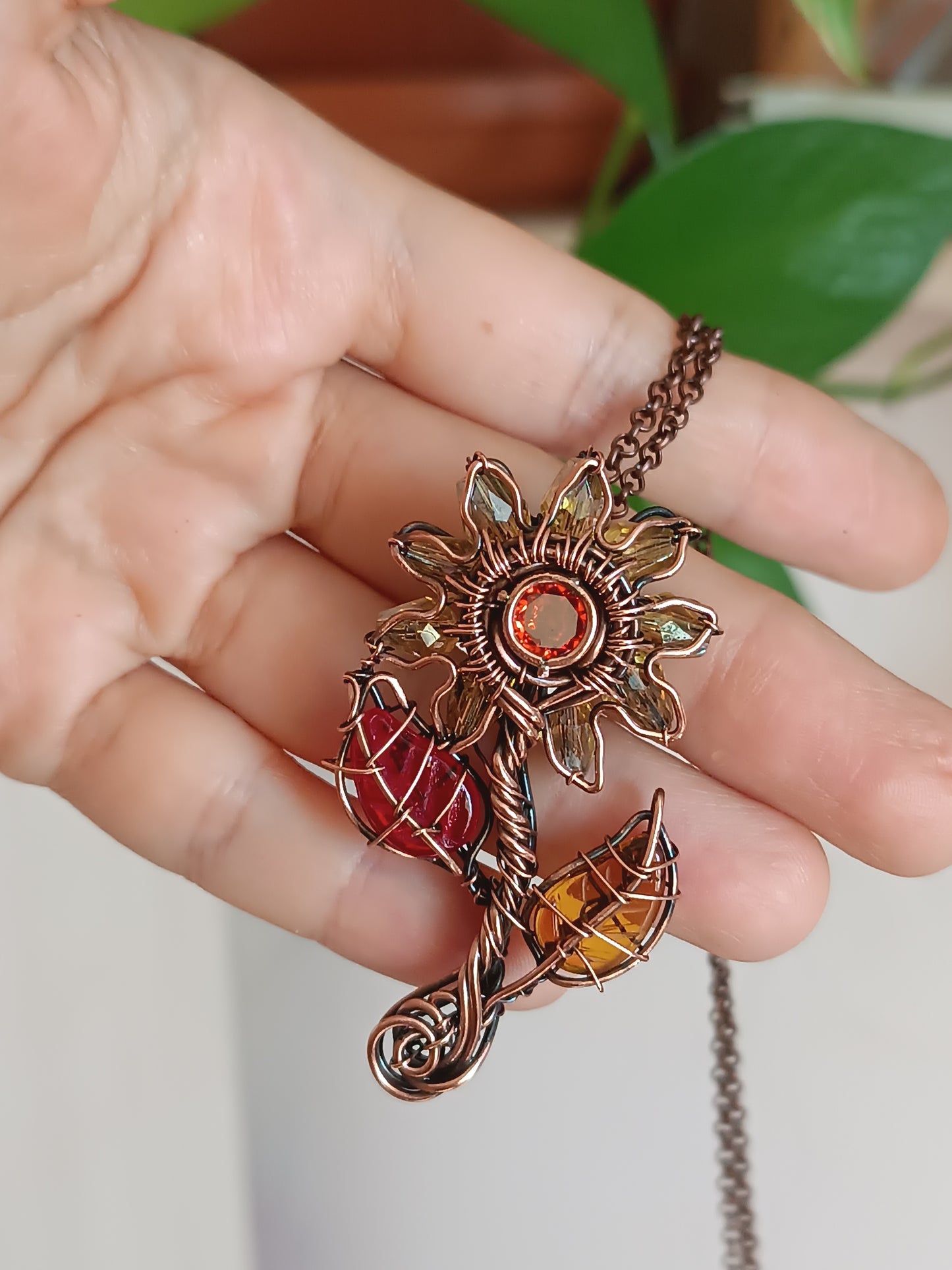 Sunflower pendant with red leaf