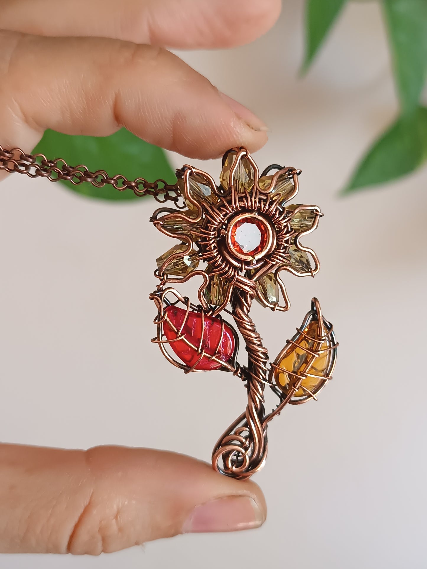 Sunflower pendant with red leaf