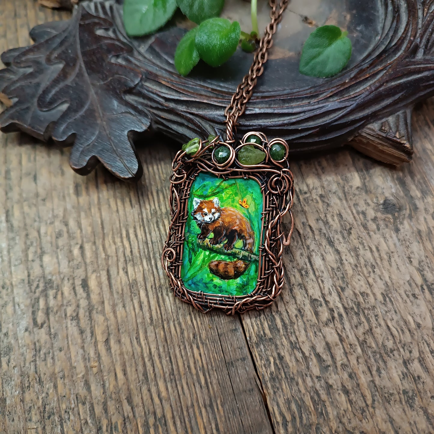 Red panda and a butterfly necklace. Reversible.